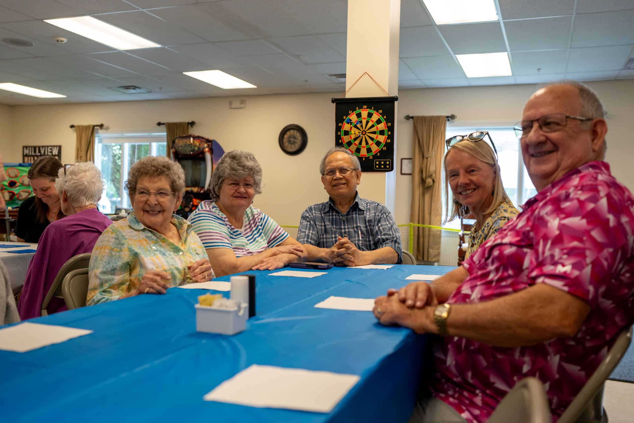 Residents sitting around a table together