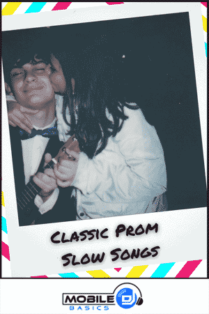 A young couple in formal attire shares a close moment at prom; one person kisses the other's cheek. Text reads "Classic Prom Songs" with a Mobile Basics logo below.