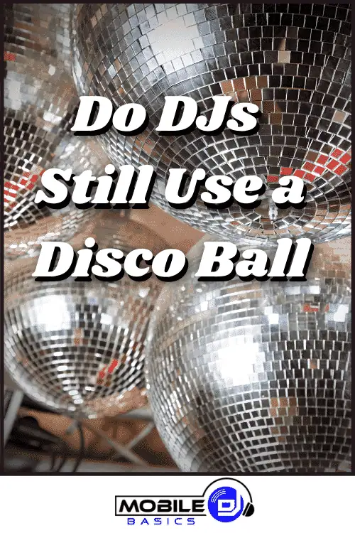 Several mirrored disco balls are clustered together, reflecting light, with the text "Do DJs Still Use a Disco Ball" overlaid and the "Mobile DJ Basics" logo at the bottom.