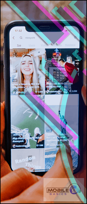 a person holding a cell phone with a picture of a woman on the screen.