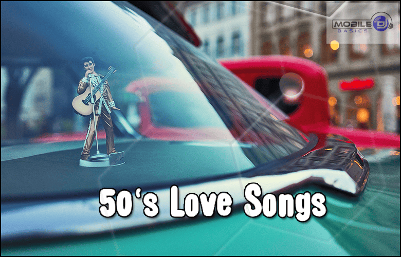 A dashboard figurine of a guitarist sits on a classic car, with the text "Love Songs" over the image and vintage cars in the background, evoking timeless romance.