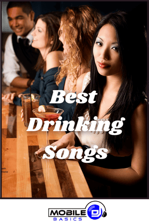 Four people sit at a bar, two with drinks, smiling and talking. Overlaid text reads "Best Drinking Songs," capturing a lively moment and friendship, with a Mobile Basics logo at the bottom.