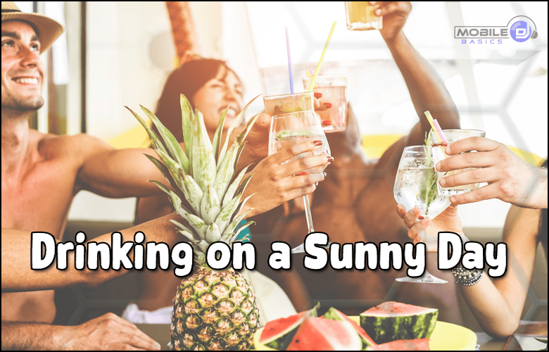A group of people raise drinks around a table with fruit, including pineapple and watermelon, on a sunny day. Text reads “Drinking Songs for a Sunny Day.”.