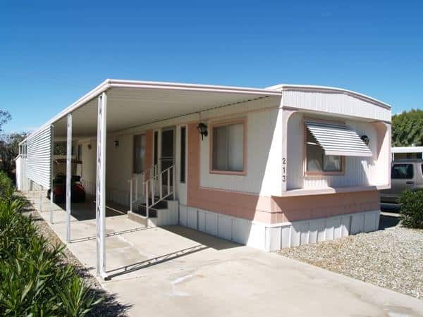 Favorite Classic Mobile Home Models of Mobile Home Experts - Fleetwood Festival Single Wide - Exterior White with Coral Trim End Image 