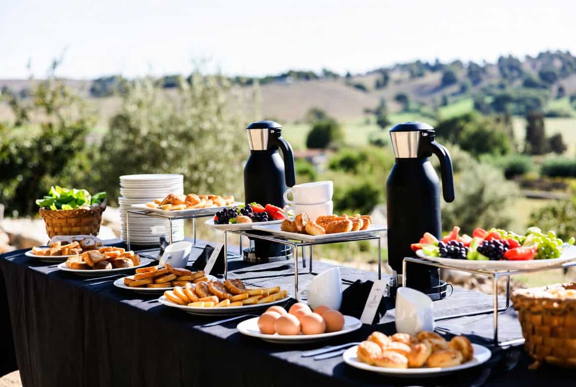 Brunch buffet table with pastries fruit eggs and coffee