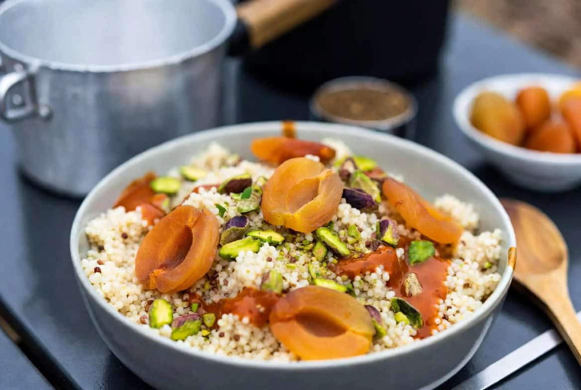Couscous with dried apricots pistachios and harissa oil