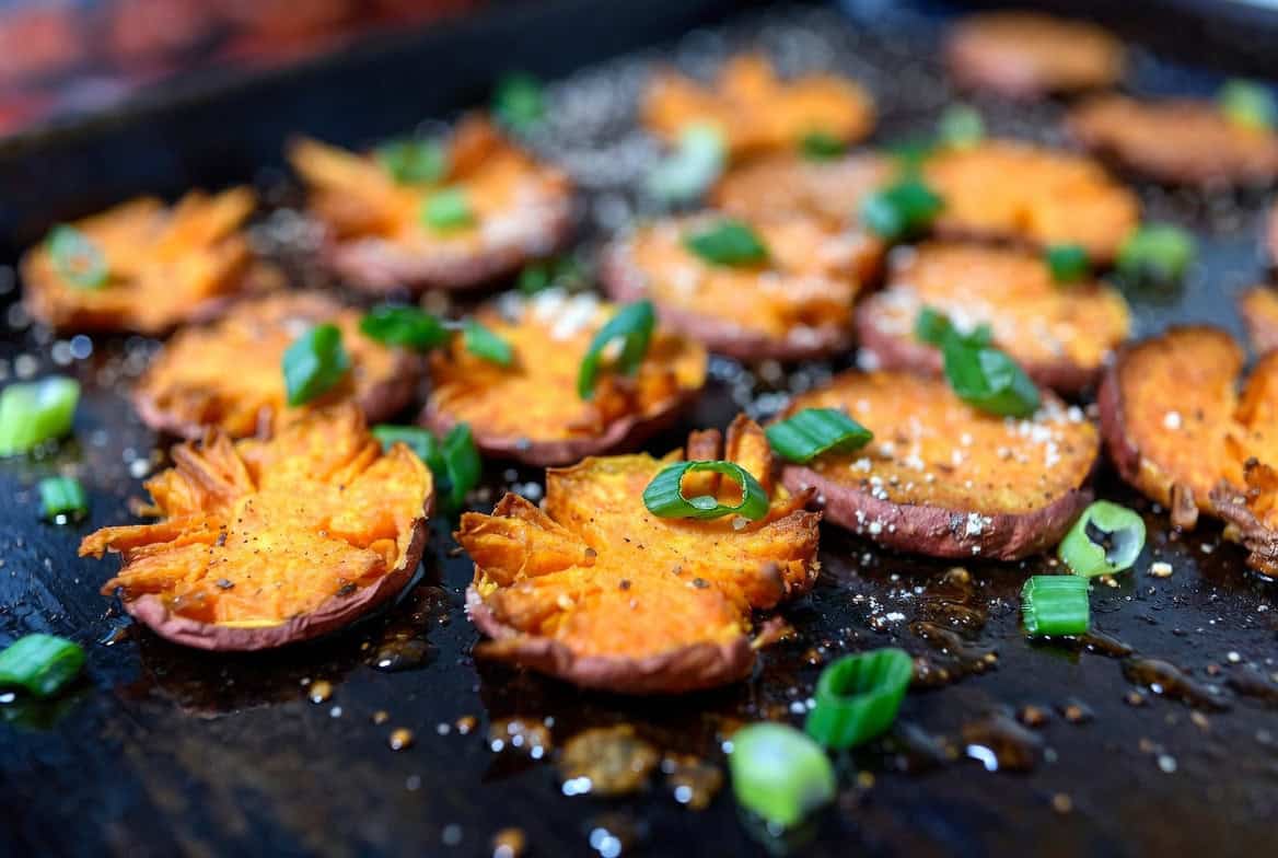 Crispy smashed sweet potatoes with ranch dust and scallions