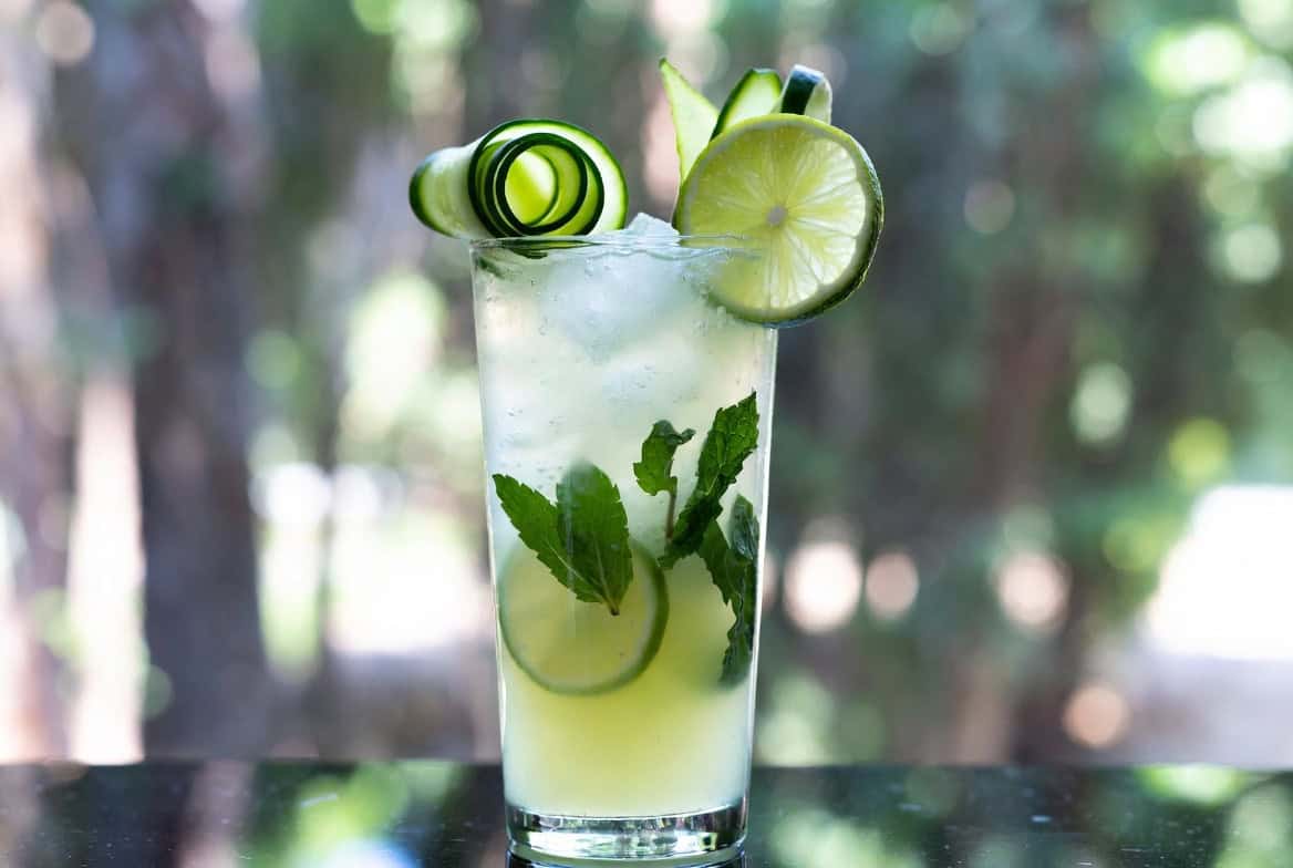 Ginger-lime cooler with cucumber ribbons lime and mint