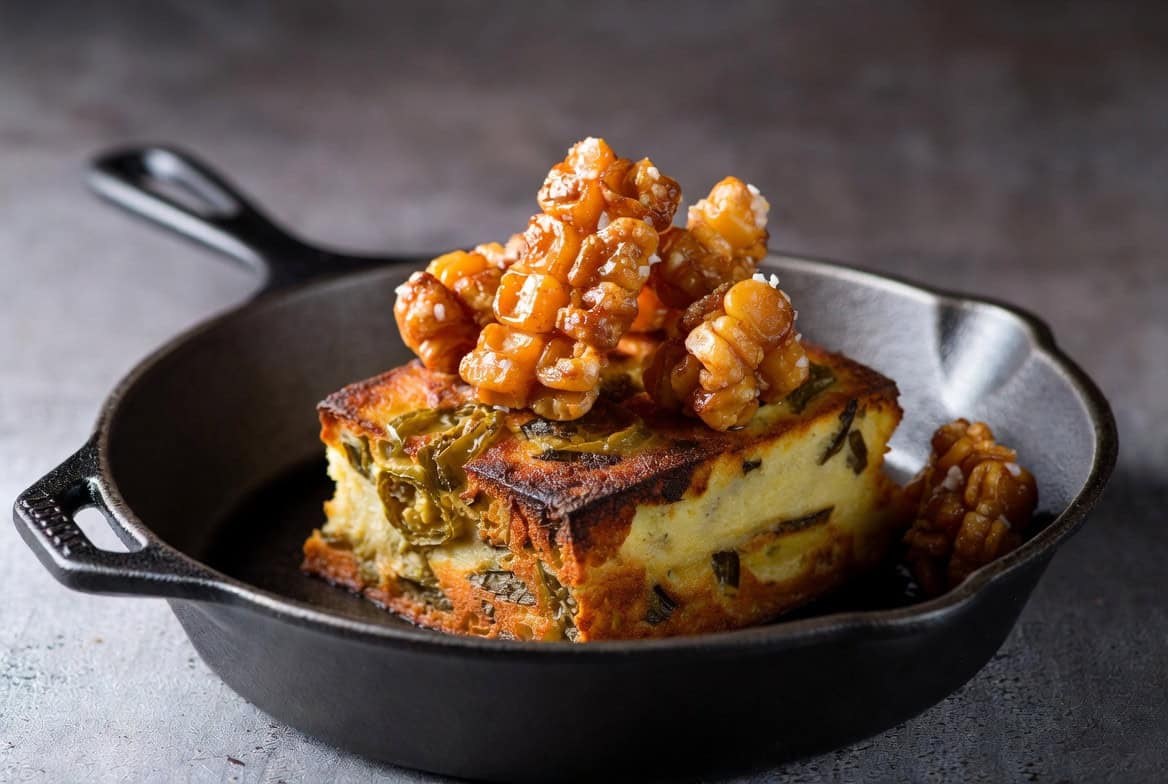 Jalapeño spoonbread topped with salted corn brittle