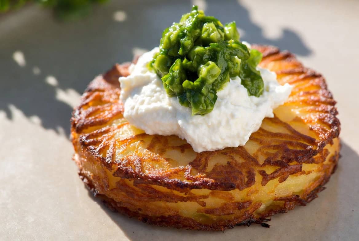 Crispy potato rosti with whipped ricotta and pea relish