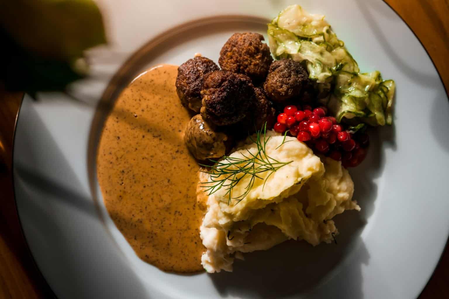 Meatballs with mashed potatoes and gravy, plated for make-ahead hosting