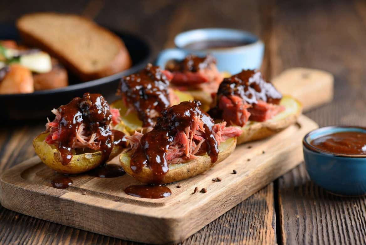 Potato skins filled with shredded brisket and coffee barbecue glaze