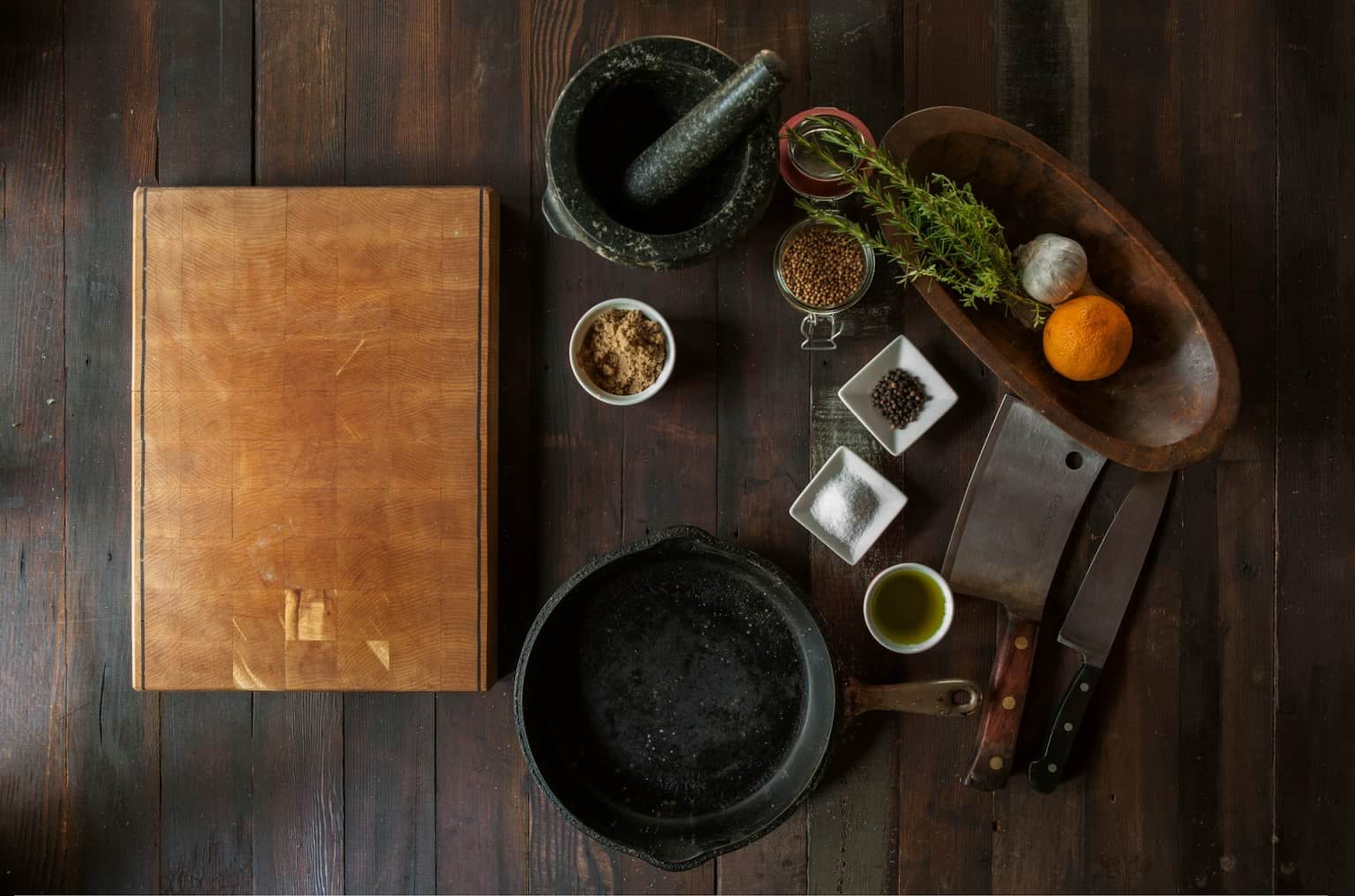 Overhead view of ingredients and tools on a chef station