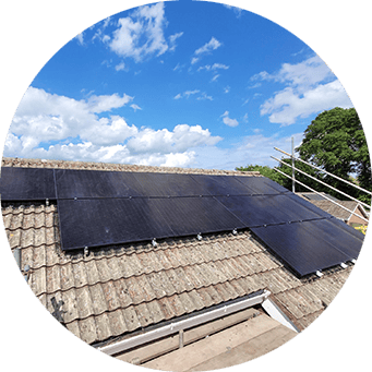 a round picture of a roof with a solar panel on it.