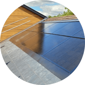 A solar panel on the roof of a house.