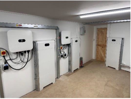 A room with a lot of electrical equipment in it.