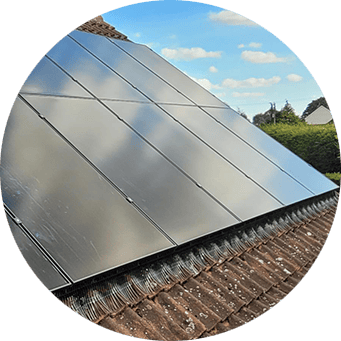 A solar panel on the roof of a house.