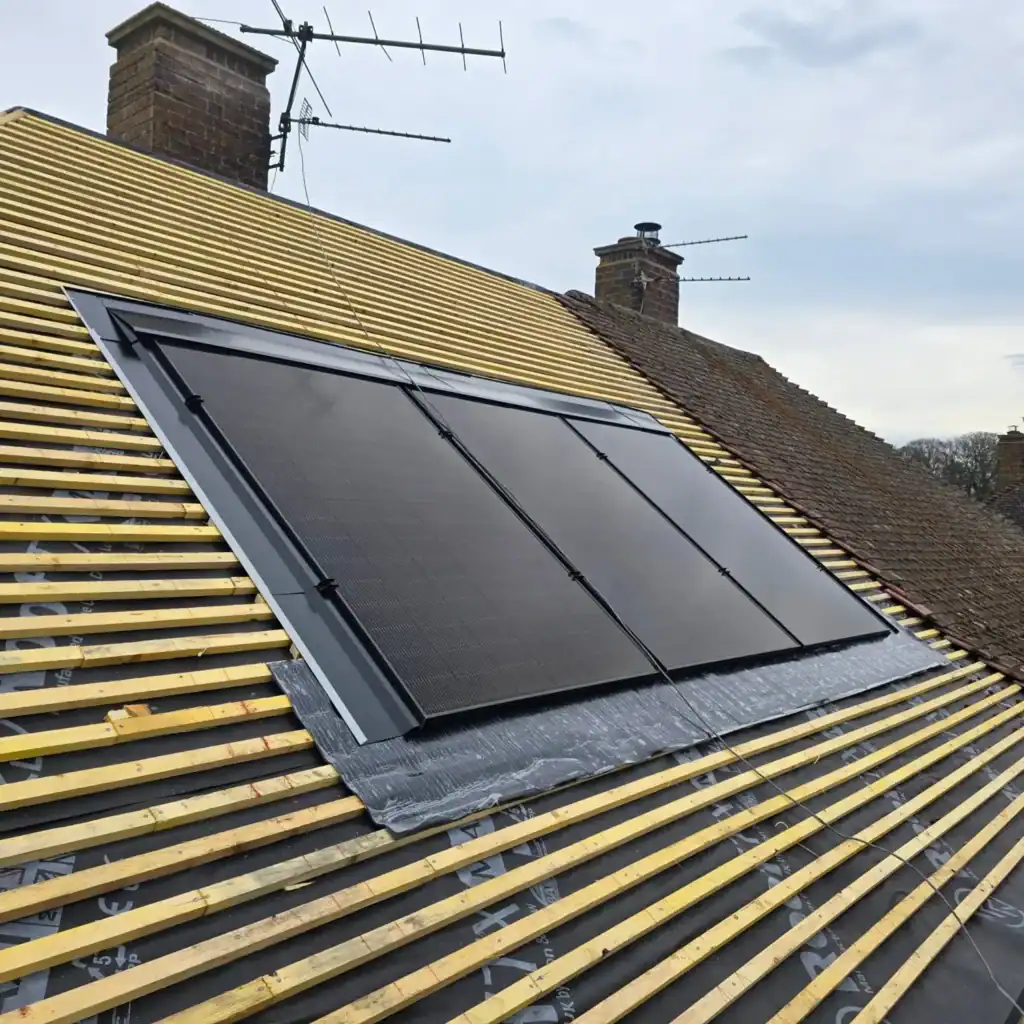 Newly installed solar panels on a partially re-tiled residential roof in Norfolk.