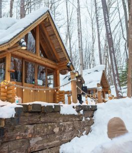 Beautiful Cottage in the forest at Furano Ningle Terrace with Snow in winter season. landmark and popular for attractions in Hokkaido, Japan. Travel and Vacation concept