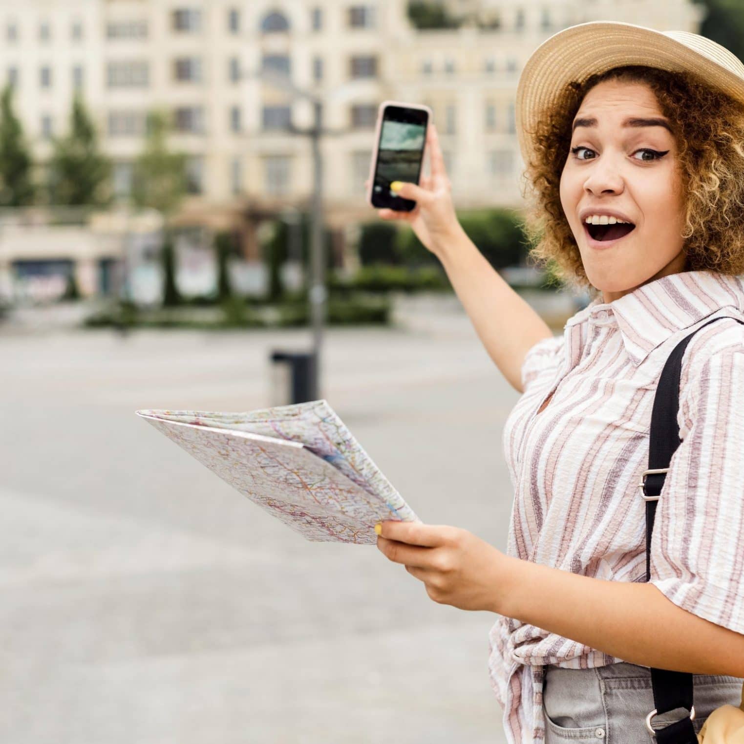 shocked-woman-holding-map-phone