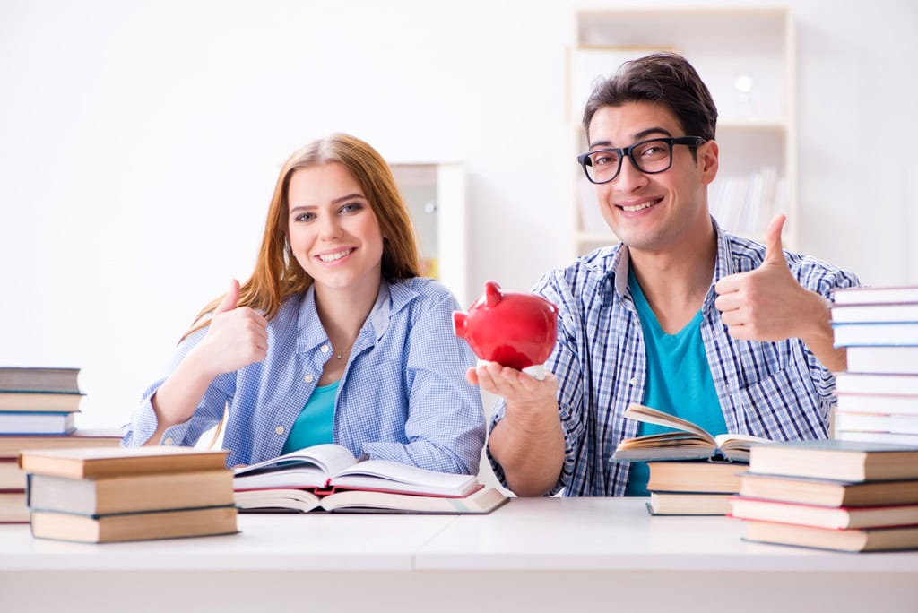 Two students checking savings as they consider making college affordable Two students checking savings as they consider making college affordable