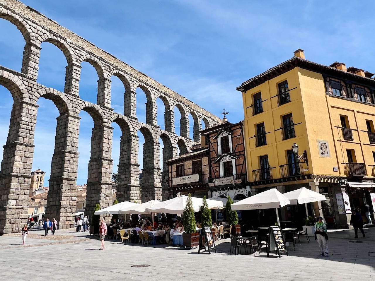 The Roman Aqueduct in Segovia Spain along with nearby houses