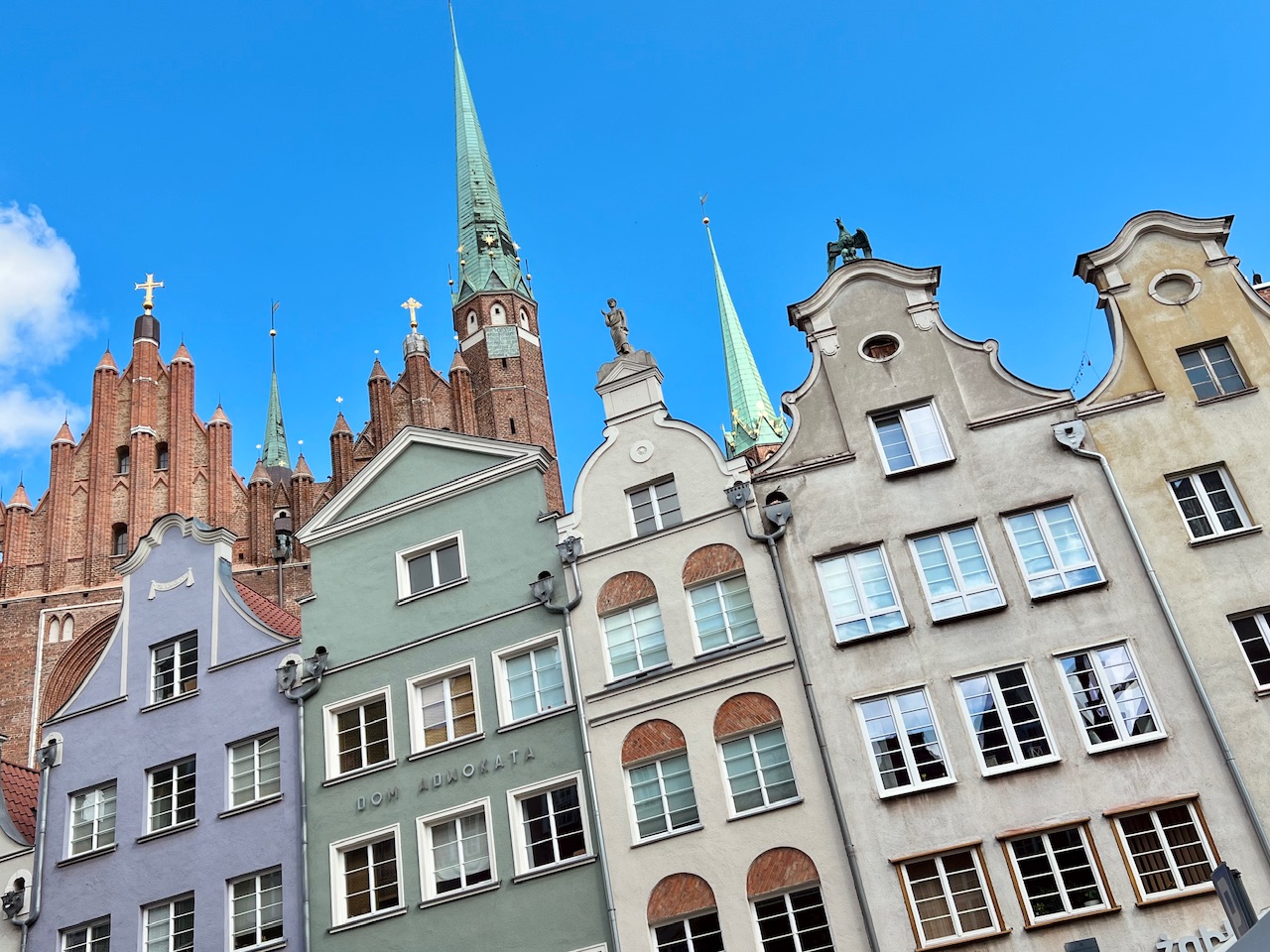St Mary's Church in Gdansk Poland towering over some of Gdansk's colorful burgher houses