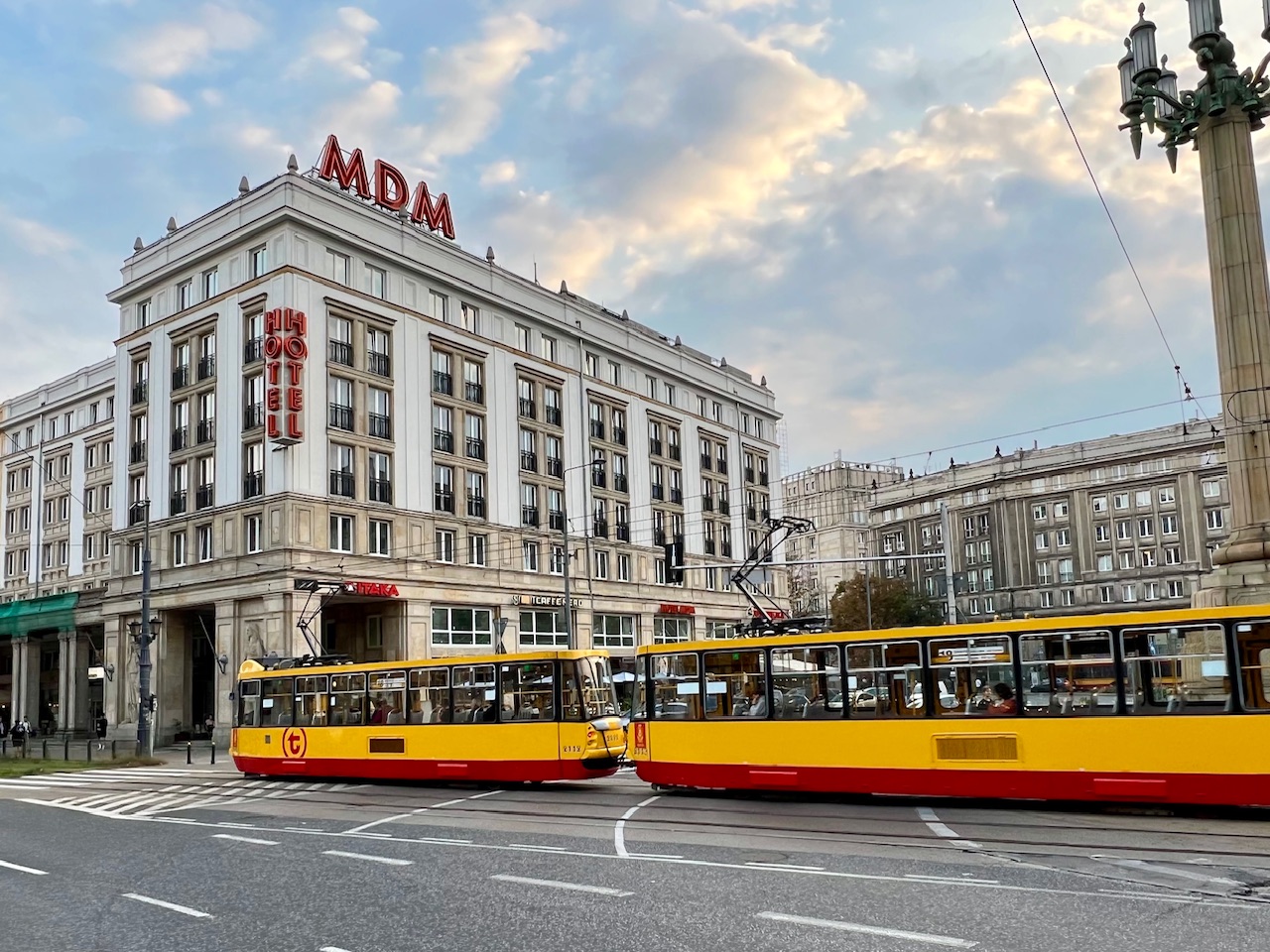 A tram in the center of Warsaw Poland's Constitution Square in front of the MDM Hotel