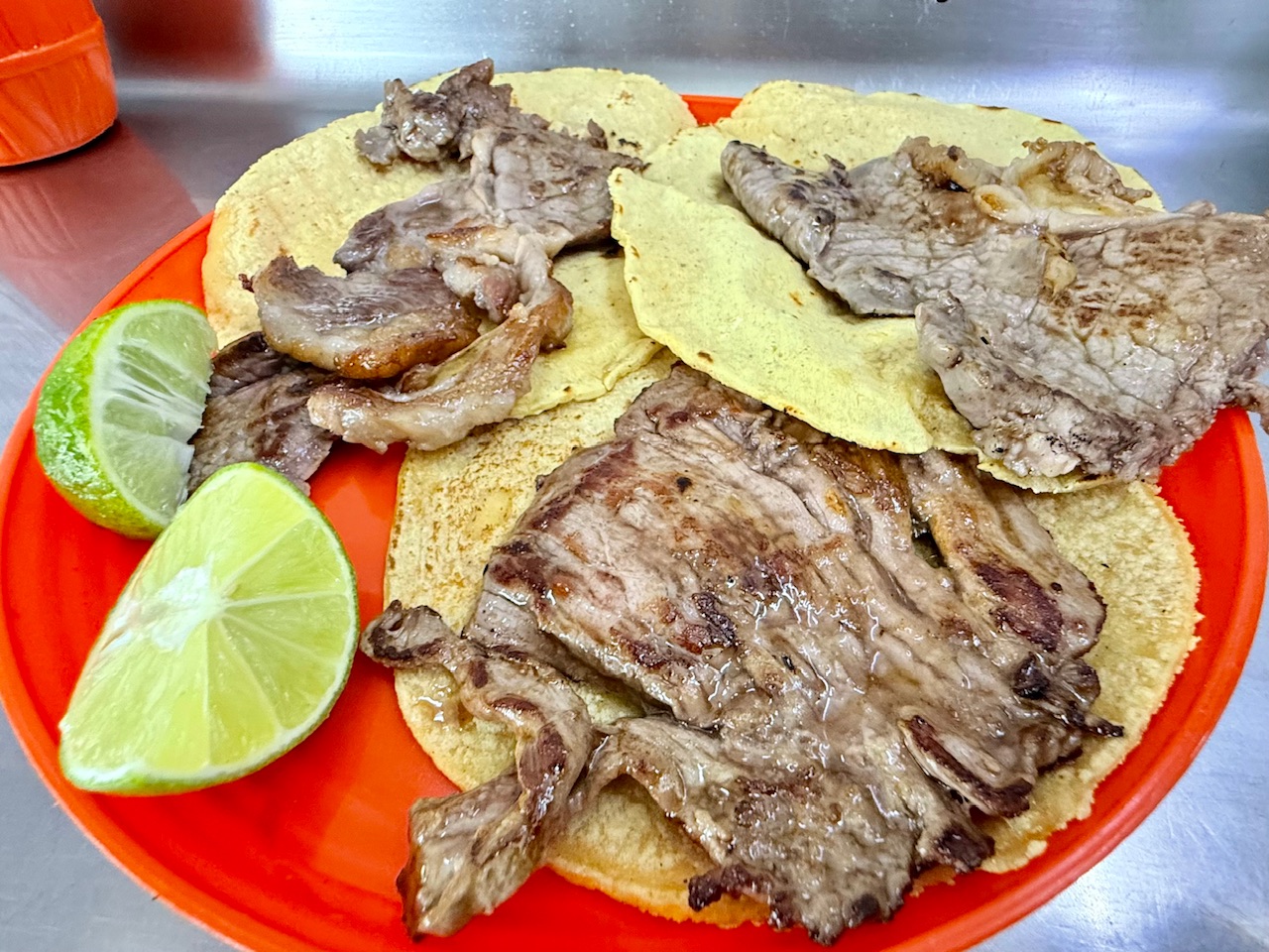 A plate of with Costilla and Gaonera tacos at Tacos El Calfia De Leon in Mexico City. The taco shop with a Michelin star