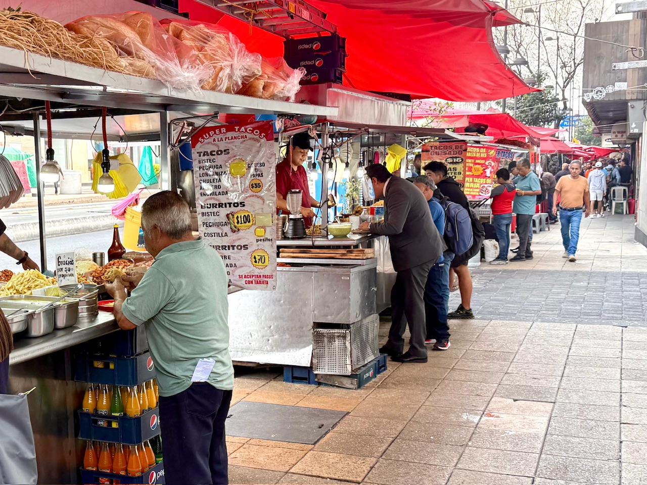 A long line of street food kiosks in Mexico City