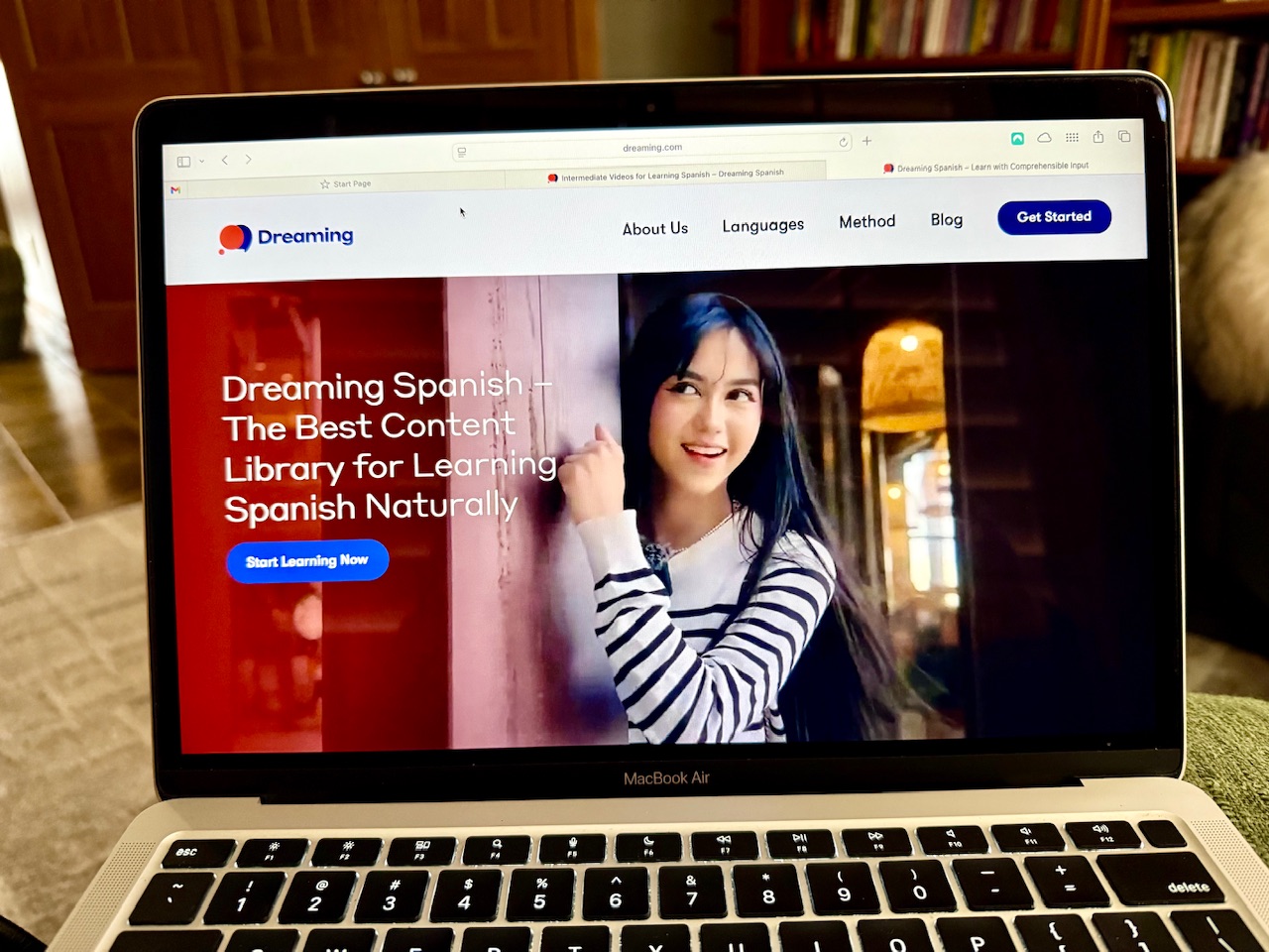 Laptop screen showing the Dreaming Spanish website