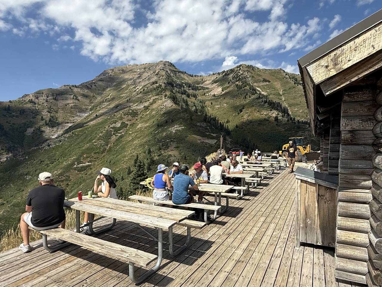 Patron eating food and enjoying the views from the Bear Claw Cabin at the Sundance Resort - one of the coolest things to do in Provo Utah
