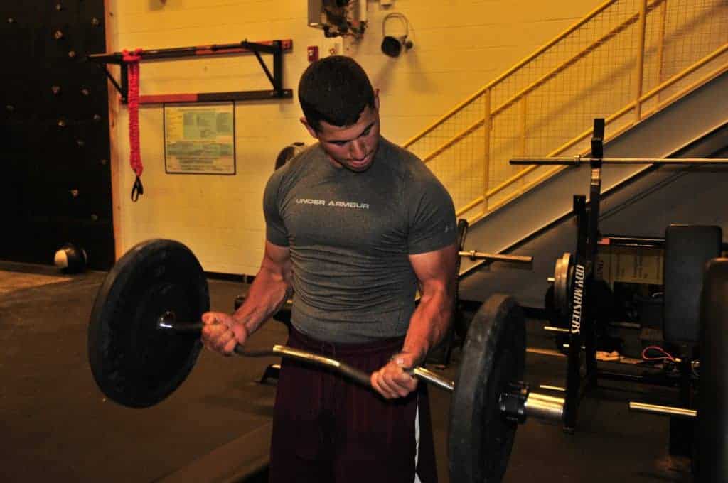 A young bodybuilder doing arm curls