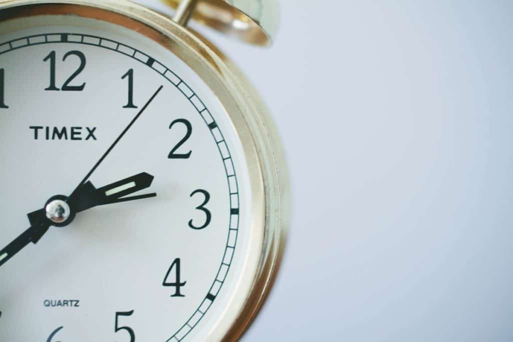 a stop watch with gold plating on a white background