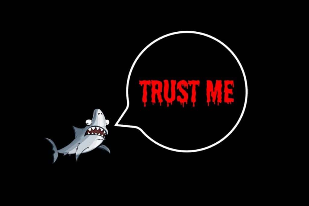 a black background with a shark and a thought bubble with the words trust me in them. Referring to how hard it is to cancel your planet firtness membership