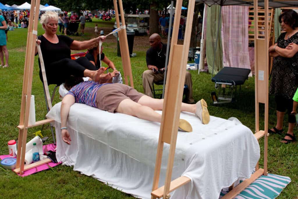 A woman receives an Ashiatsu barefoot massage 