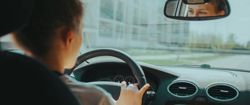 woman driving and staying connected to God