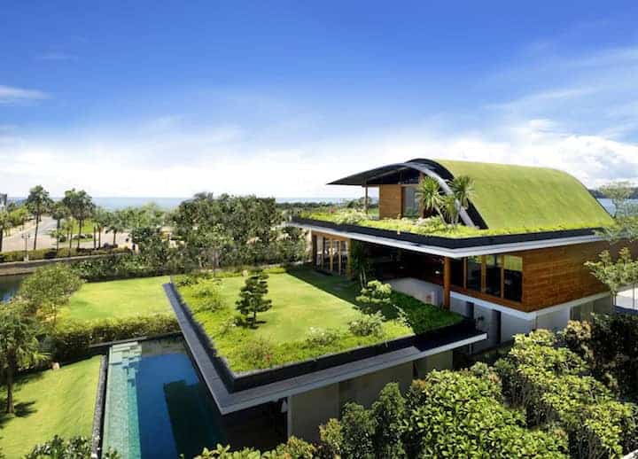 Modern luxury house with green rooftop garden and swimming pool, contemporary architecture, lush landscaping, scenic ocean view, eco-friendly design, minimalist style, and sustainable living features.