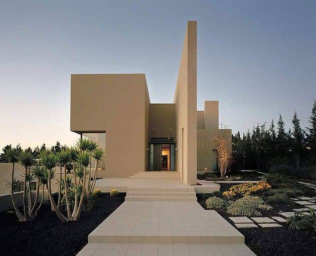 Modern minimalist house with clean lines and geometric design, showcasing contemporary architecture and landscape landscaping. Perfect for stylish urban living.