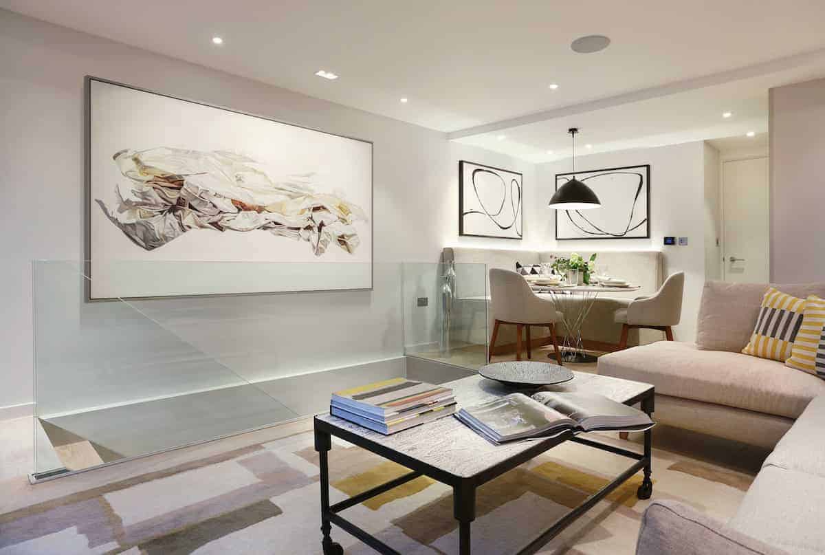 Modern minimalist living room with contemporary art, sleek furniture, and soft lighting for stylish home interior design.