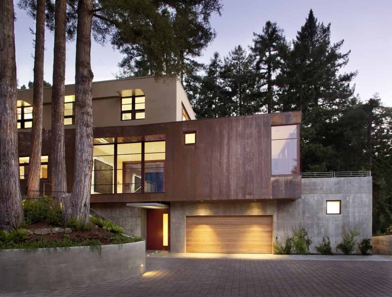 Contemporary modern house architecture with a combination of wood and concrete materials, nestled among tall trees in a natural setting. Innovative design blending minimalism and luxury in residential architecture.