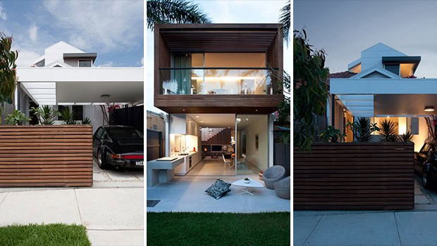 Modern minimalist house with sleek white exterior and spacious garage, featuring contemporary architectural design and clean lines.