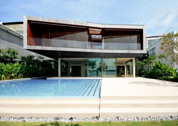 Modern luxury house with contemporary architectural design featuring large glass windows, sleek exterior and private swimming pool, perfect for upscale residential living.