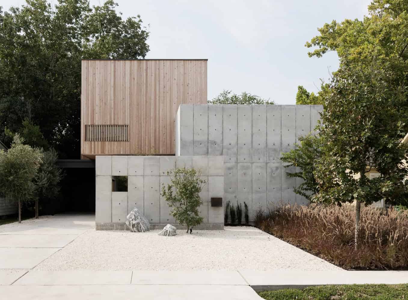 Wooden modern house exterior with concrete wall and landscaped garden, minimalistic architectural design focusing on contemporary style and natural materials.