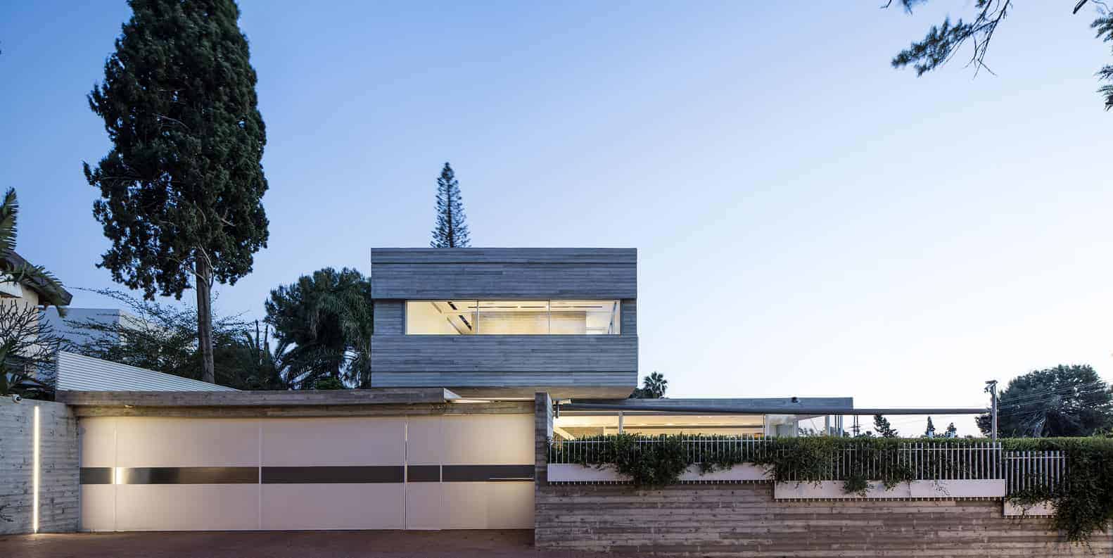 Modern minimalist house with sleek wooden exterior, large windows, and contemporary garden design, reflecting innovative architecture and stylish residential architecture trends.