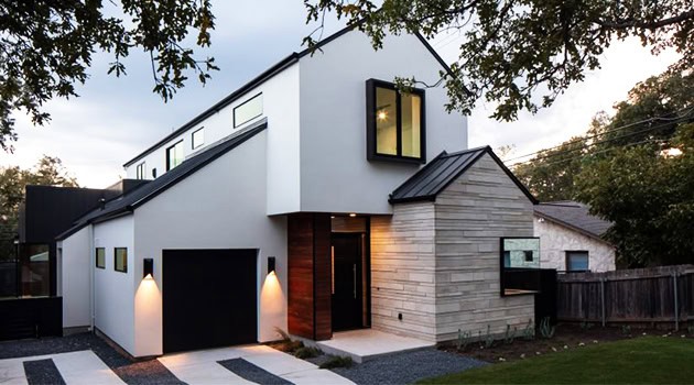 Modern contemporary house with sleek geometric design and minimalist architecture, featuring clean lines, large windows, and mixed materials for stylish urban living.