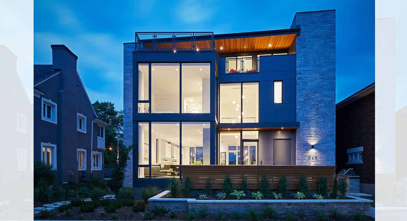 Contemporary modern house with large glass windows and sleek architectural design, featuring an inviting interior illuminated at dusk, showcasing innovative architecture art designs.
