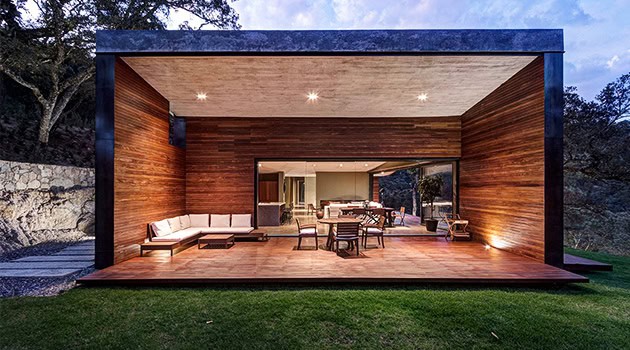 Contemporary modern outdoor living space with wooden deck, featuring warm lighting, stylish furniture, and seamless indoor-outdoor transition. Perfect for relaxation and entertaining in sleek architectural design.