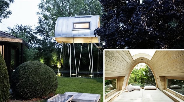 Unique tiny house on stilts with modern design in a lush outdoor setting.