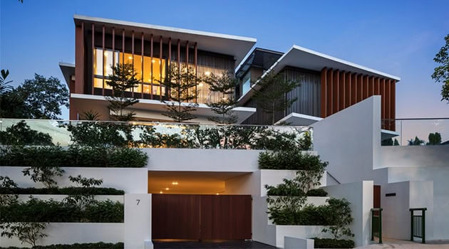 Luxury modern house with contemporary architecture, sleek lines, and large glass windows, featuring innovative design and lush landscaping.